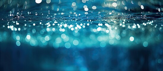 A soft focus background of sparkling lights in a pool suitable for text or graphics with copy space image available