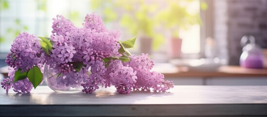 Springtime lilac flower arrangement on the kitchen table with copy space image