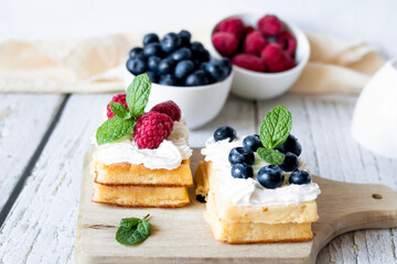 
Belgian Waffles with cream and fruit. on a wooden background. dessert