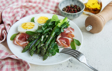 Fresh Asparagus and Prosciutto Salad Served With Boiled Eggs and Microgreens