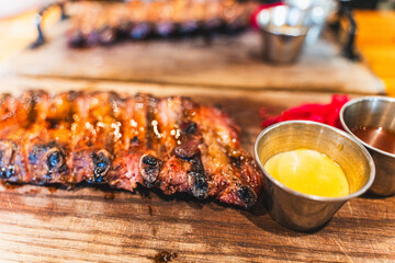 Delicious barbecued ribs seasoned with a spicy basting sauce. Smoked American style pork ribs. Top...