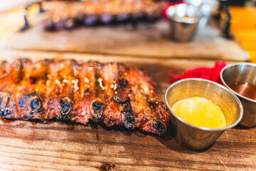 Delicious barbecued ribs seasoned with a spicy basting sauce. Smoked American style pork ribs. Top view. Selected focus