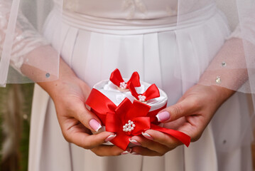 a wedding gift in the hands of the bride