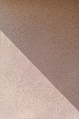 a diagonal shadow on the wall. vertical