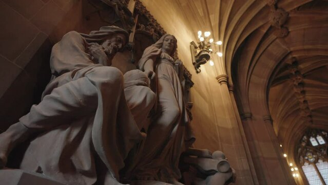 Manchester, UK - The statue of Theology, Science, and Art by John Cassidy is located in the vestibule of the John Rylands Research Institute and Library in Manchester, UK.