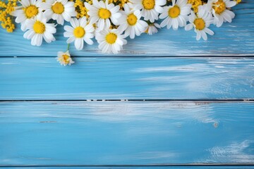 flowers on a blue wooden background with top views,