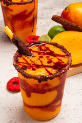Mangonada, typical mexican mango smoothie with chamoy sauce and lime juice.