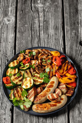 grilled white sausages with veggies and mushrooms