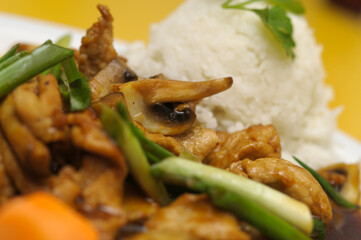 Fried rice with meat and vegetables on a plate, Thai cuisine
