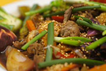 Fried rice with meat and vegetables on a plate, Thai cuisine