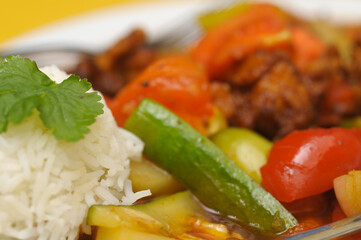 Fried rice with meat and vegetables on a plate, Thai cuisine