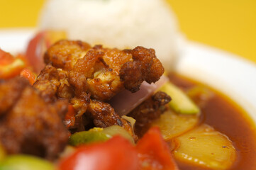 Fried rice with meat and vegetables on a plate, Thai cuisine