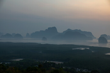 Beautiful and colorful sunrise over the sea. Large rocks in the sea. Dawn in Thailand. Colorful sky in the morning.