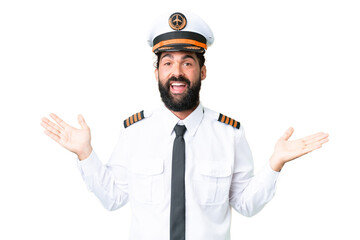 Airplane caucasian pilot man over isolated chroma key background with shocked facial expression