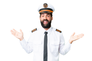 Airplane caucasian pilot man over isolated chroma key background with shocked facial expression