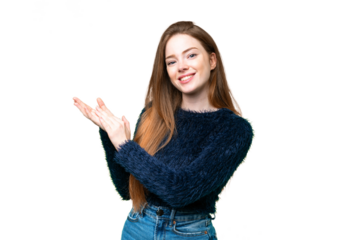 Young pretty woman over isolated chroma key background applauding