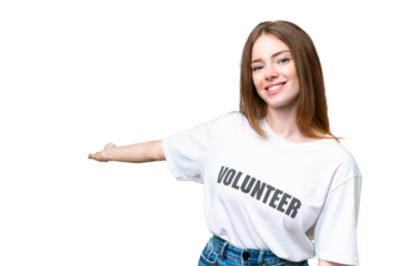Young volunteer woman over isolated chroma key background extending hands to the side for inviting to come