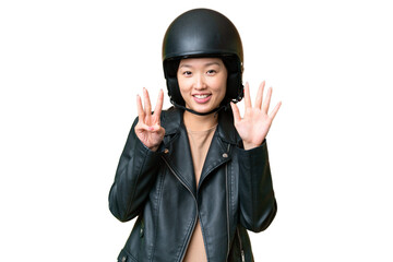 Young Asian woman with a motorcycle helmet over isolated chroma key background counting eight with fingers