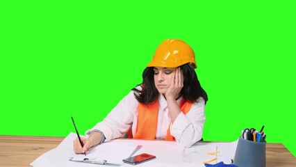 Tired female designer working with drawing on the chroma key