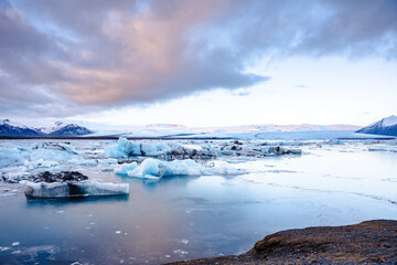 Glacier Lagoon Jokularlon with mountains and snow in the background