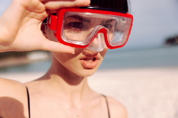 Joyful Woman Snorkeling in Fashionable Red Swimsuit: Smiling Portrait in Tropical Beach Vacation