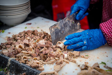 Traditional Chinese market stalls, steaming lamb soup, and haggis on a winter's day