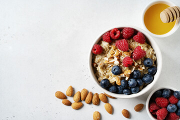 Porridge with berries, blueberry and raspberry and almond nuts