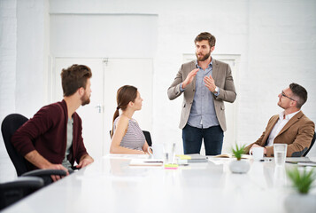 Business team, discussion and meeting in office for strategy for project management, information and client feedback. Conversation, boardroom and creative ideas for collaboration on company task. © peopleimages.com