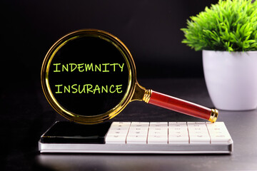 INDEMNITY INSURANCE text appeared through a magnifying glass on a black background with a green...