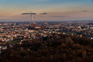 the cityscape is full of tall buildings and some trees