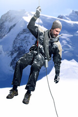 Snow, mountain and man as climber for fitness with rope, challenge and adventure for sports, gear and travel in winter. Male athlete, exercise and nature with adrenaline for journey in Switzerland