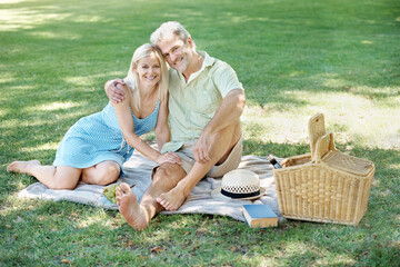 Picnic, hug and portrait of couple in park for marriage, anniversary and adventure together. Man, woman and smile with love at countryside for vacation, romance and outdoor bonding in New Zealand
