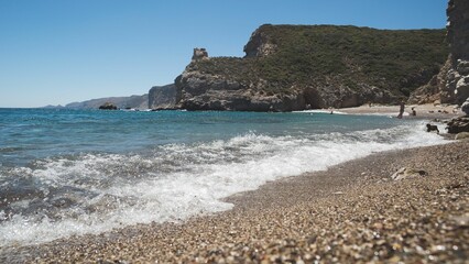 Idyllic beach with a crystal-clear ocean view, featuring a rocky shoreline in Kythera Island