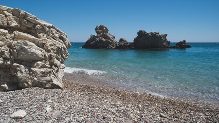 Idyllic beach with a crystal-clear ocean view, featuring a rocky shoreline in Kythera Island