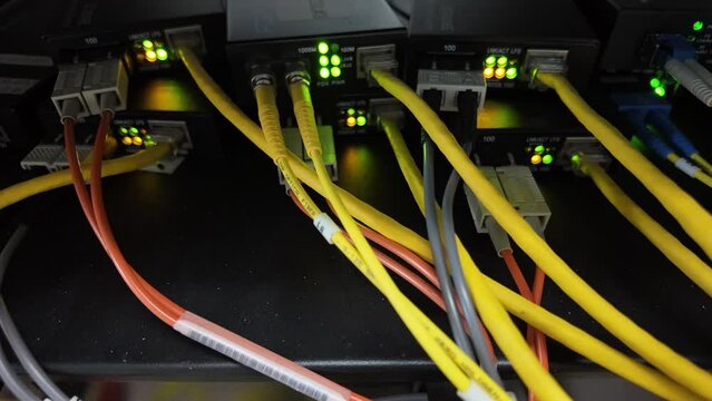 Fiber optic cables for connecting multi-mode and single-mode networks and communications systems with media converters and background lighting.