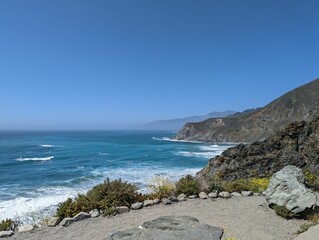 Beautiful blue sea landscape many stones of different sizes on the shore