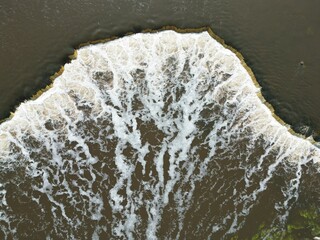 Aerial top down view of Venta Rapid (Ventas Rumba) waterfall in spring