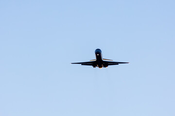 Dynamic View of a Military Jet Aircraft Soaring in a Clear Blue Sky, Showcasing Power and Speed.