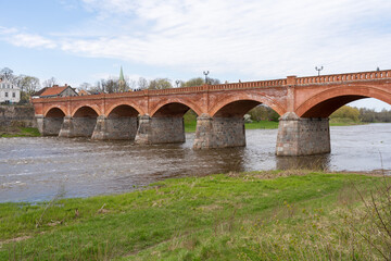 The old red brick bridge across the Venta river. Kuldiga, Latvia