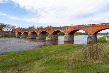 The old red brick bridge across the Venta river. Kuldiga, Latvia