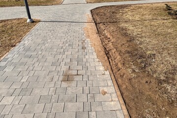 A walking path in the form of paving stones in the park for walking in free time for people in the...
