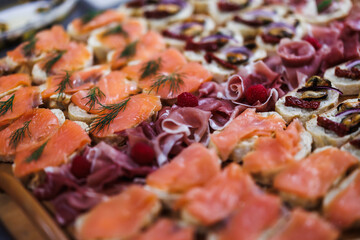 Canapes with seafood and smoked salmon and parm ham. Food styling for a buffet at festive event