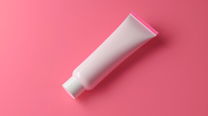 Minimalistic white tube on a vibrant pink background, embodying elegant simplicity.