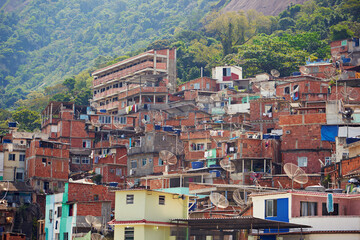 Brazil, house and infrastructure in city for neighborhood, outdoor and urban in Favela hill. Rio da...