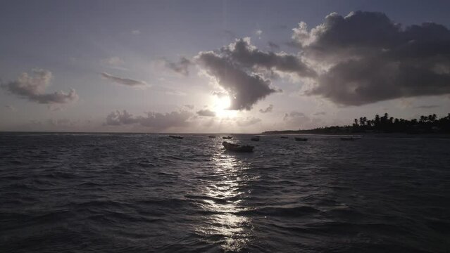 A scenic view of boats at dawn at Praia Da Baleia, Itapipoca, Brazil