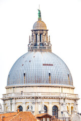 Venice, Italy. Cover page over main dome of Basilica di Santa Maria della Salute with statues, in...