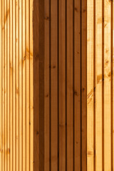 the wall of wood planks has been covered in light