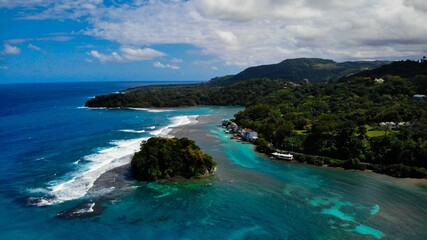 Breathtaking aerial shot of a stunning island situated in a tranquil blue body of water