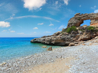 Hole in rock on Drymades beach, Albania. Summer  Ionian sea coast view.
