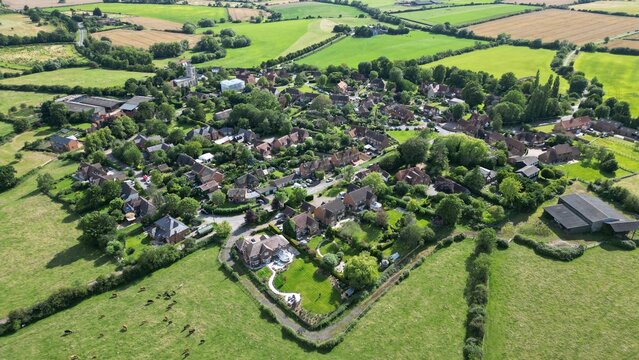English village of Hardwick in Buckinghamshire showing houses, green fields and trees